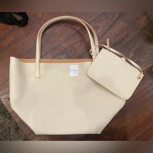 J.McLaughlin leather carry-all rich leather sleek, minimalist design.